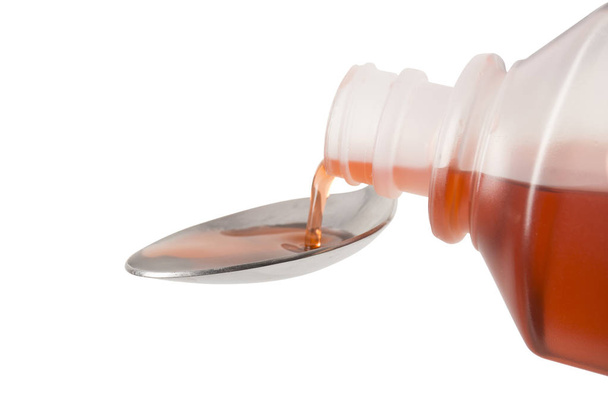 Pouring Cough Medicine on spoon - Front focus - Photo, Image