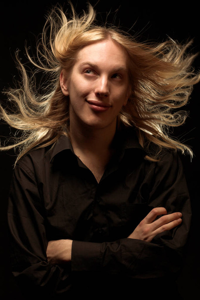 Young man with long blond hair - Foto, immagini