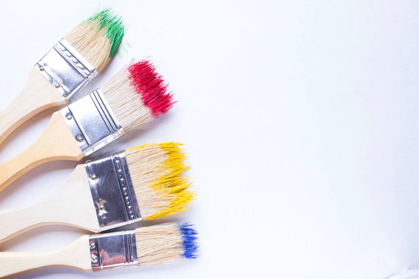 paintbrushes in colorful paint - Foto, Imagem