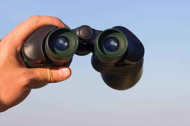 binocular in mans hands - Foto, Imagen