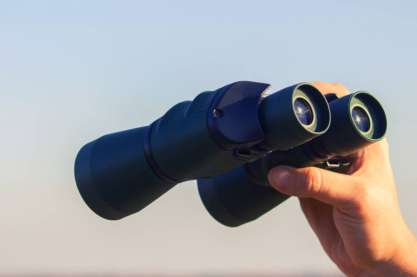 binocular in mans hands - Фото, изображение