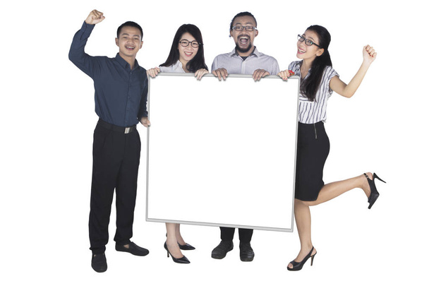 Excited business people showing empty board - Foto, immagini
