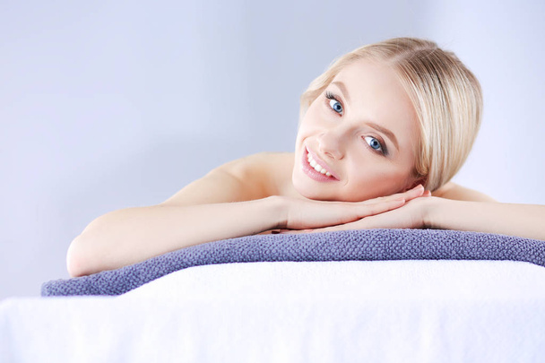 Young woman lying on a massage table,relaxing . Woman. Spa salon - Foto, immagini