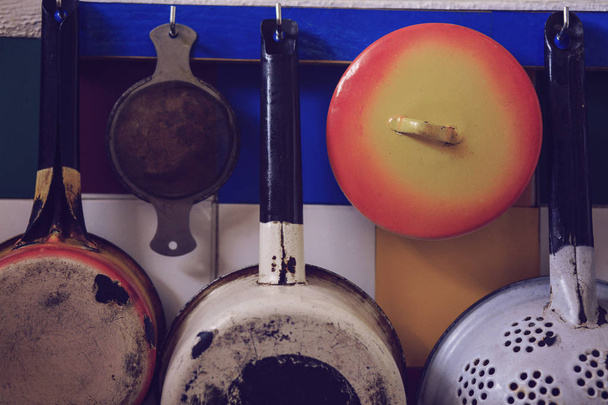 Dishes on the wall on a bright background - 写真・画像