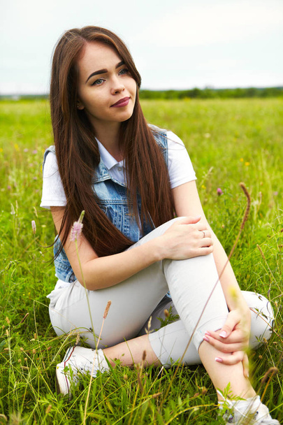 Beautiful girl in a meadow - Foto, Imagem