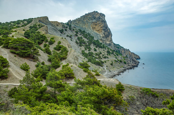A walking trail in the mountains by the sea - Fotó, kép