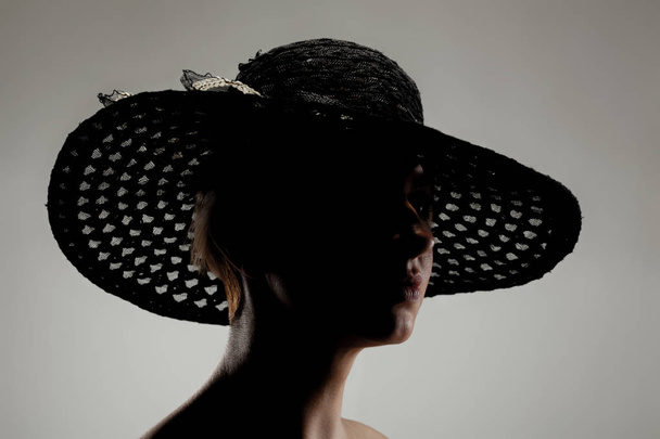 silhouette girl portrait with a hat - Photo, Image