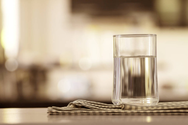 the Glass of purified water on the table bar in kitchenroom - Photo, Image