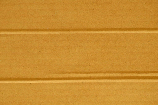  καφέ σκληρό χάρτινο κουτί πτυχή γραμμή υπόβαθρο και υφή - Φωτογραφία, εικόνα