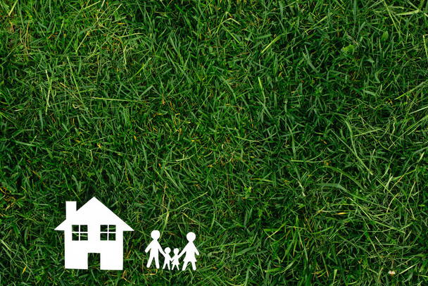 family and the house against the background of greens - Photo, Image