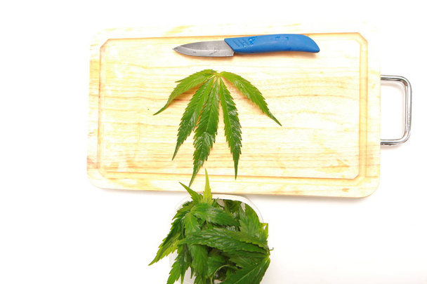 Fresh hemp leaves for salad preparation. The medical cannabis - Фото, изображение
