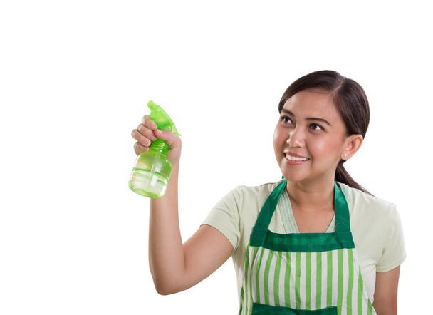 Mujer señalando botella de spray transparente en copyspace
 - Foto, imagen