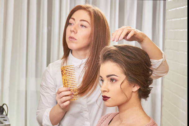 Woman and hairdresser with comb. - Photo, Image