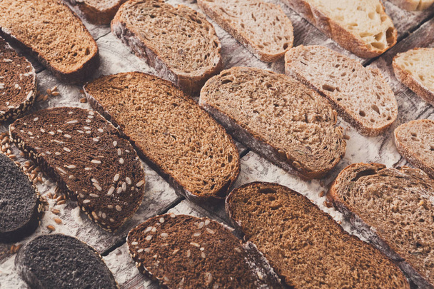 Bakery concept. Plenty of sliced bread background - Фото, изображение