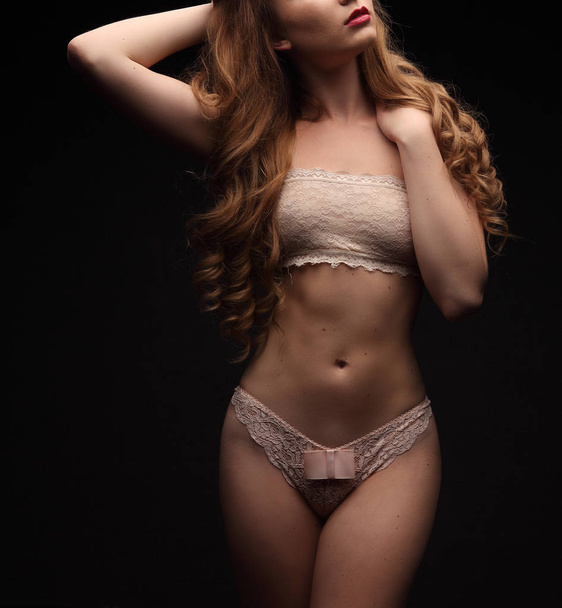 Sexy young beautiful woman with long curly hair in sensual lingerie - Fotografie, Obrázek
