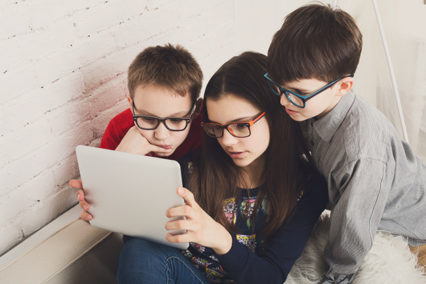 Kids in glasses with tablet, computer addiction - Фото, зображення