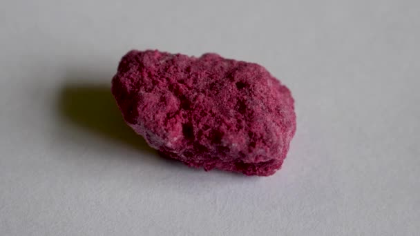 Colored rock with lazurite crystals on white background front view - Footage, Video