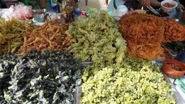 Buy spicy thai appetizer at market, Thailand (Panning shot) - Footage, Video