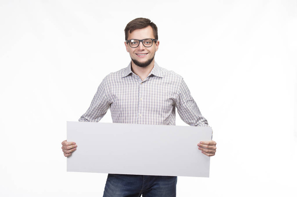 Young happy man showing presentation, pointing on placard - Foto, Imagem