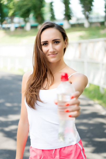 Woman drink water from bottle. - Foto, Imagem
