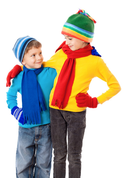 Two smiling kids in winter clothes - Fotó, kép