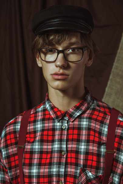 A young guy in a black cap and glasses - Photo, Image