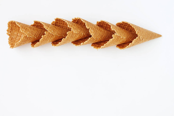 Several waffle cones lined in tower, smile, or even row, top vie - Photo, Image