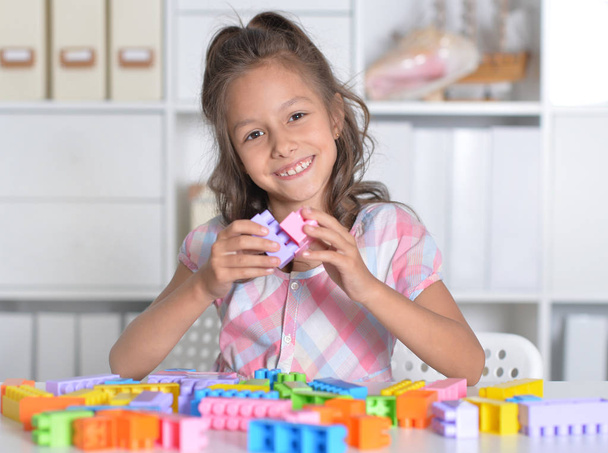 girl playing with colorful plastic blocks - Photo, Image