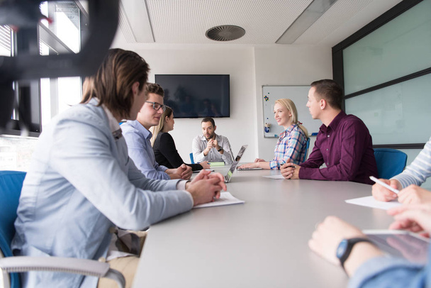 Business Team At A Meeting at modern office building - Fotoğraf, Görsel