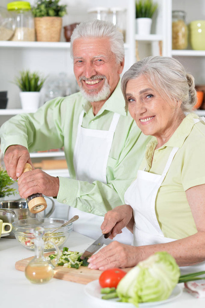 senior couple preparing dinner - Фото, изображение