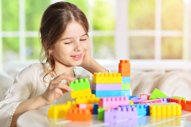 Cute girl playing with blocks - Fotó, kép