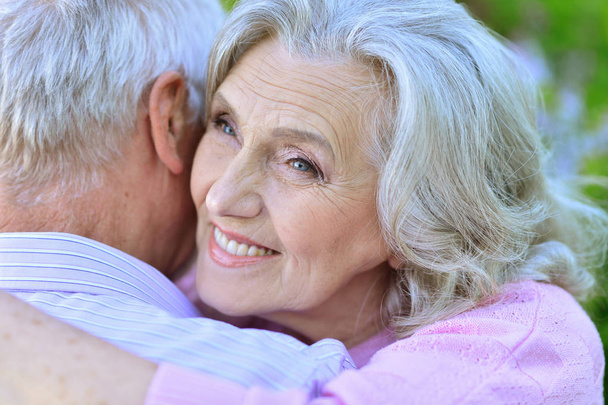 senior couple hugging  in the park - Photo, image