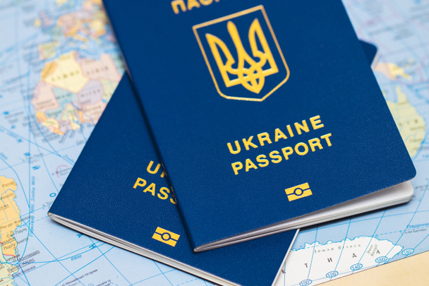 Ukrainian travel passport on a world map - Photo, Image