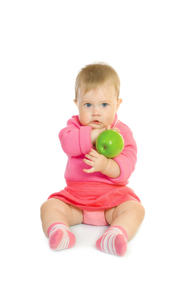 Small baby with green apple isolated - 写真・画像