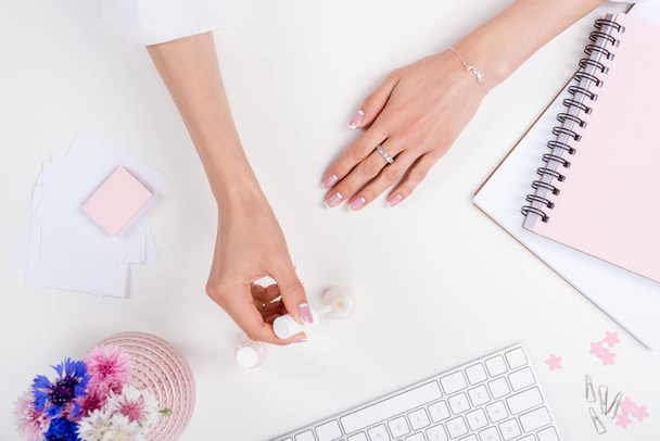 woman doing manicure at workplace  - Photo, Image