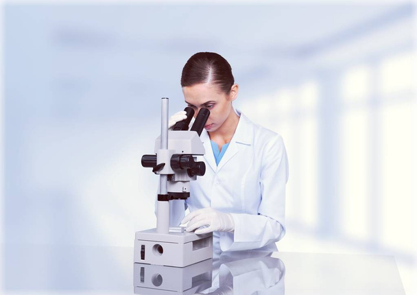 Scientist Working with Microscope - Φωτογραφία, εικόνα