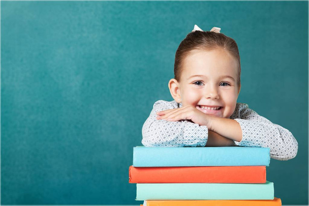 cute young girl with stack of books - Foto, Imagem