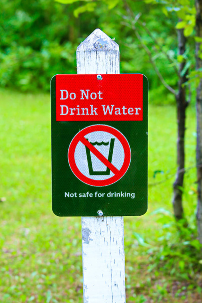A do not drink water sign with a green background - Photo, Image