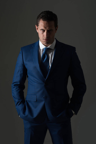 man with serious face and stylish hair in suit - Foto, afbeelding