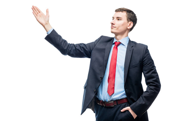 Éxito joven jefe gestos con las manos sobre un fondo blanco
 - Foto, imagen