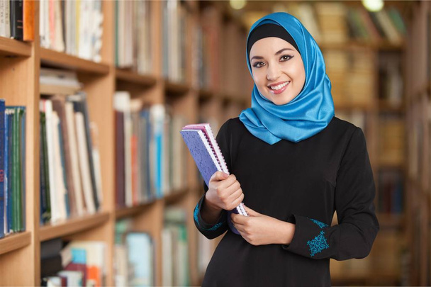 Young Muslim Woman with notebooks - Φωτογραφία, εικόνα