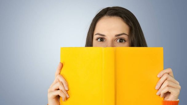 woman with book smiling - Photo, Image