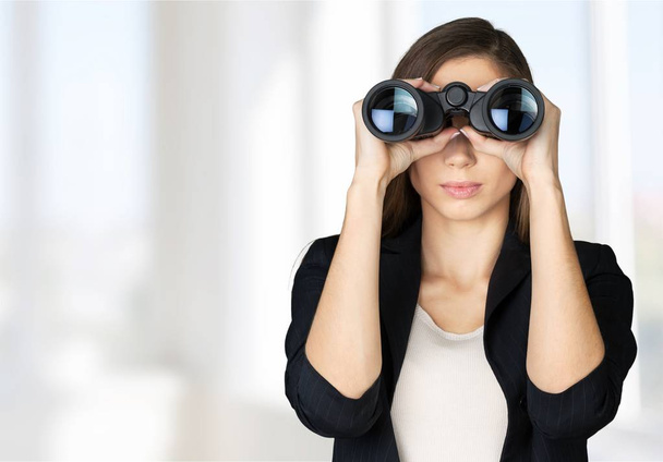 young shocked woman with binoculars - Foto, immagini