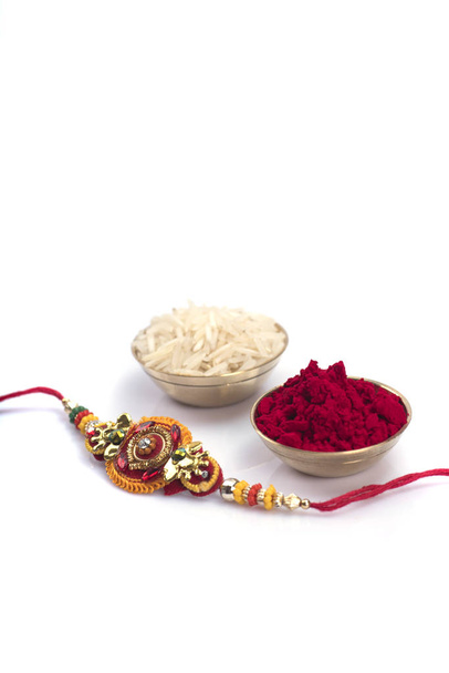 Indian festival: Raksha Bandhan background with an elegant Rakhi. A traditional Indian wrist band which is a symbol of love between Brothers and Sisters - Photo, image