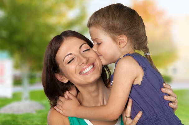 Mother and daughter hugging  - 写真・画像