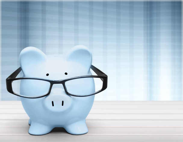  piggy bank in glasses - Фото, изображение