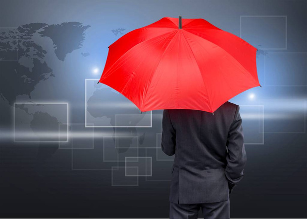 Business man holding umbrella - Foto, immagini