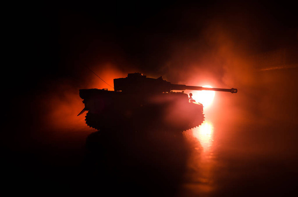 War Concept. Military silhouettes fighting scene on war fog sky background, World War German Tanks Silhouettes Below Cloudy Skyline At night. Attack scene. Armored vehicles. - Photo, Image