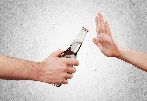 hand reject bottle of beer - Zdjęcie, obraz