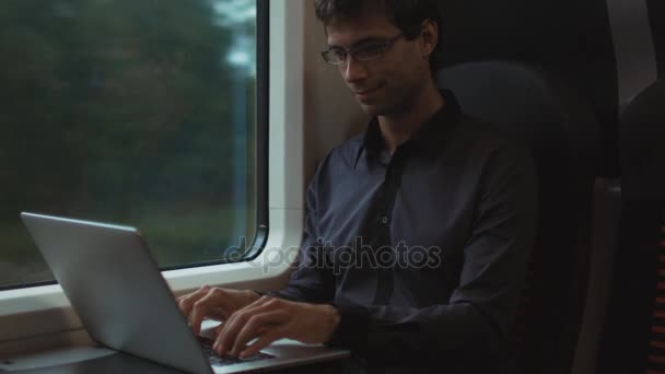 Man Working on Laptop in During Traveling on Train - Video, Çekim